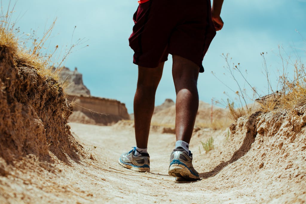 A Person Walking opersonn the Ground Soil